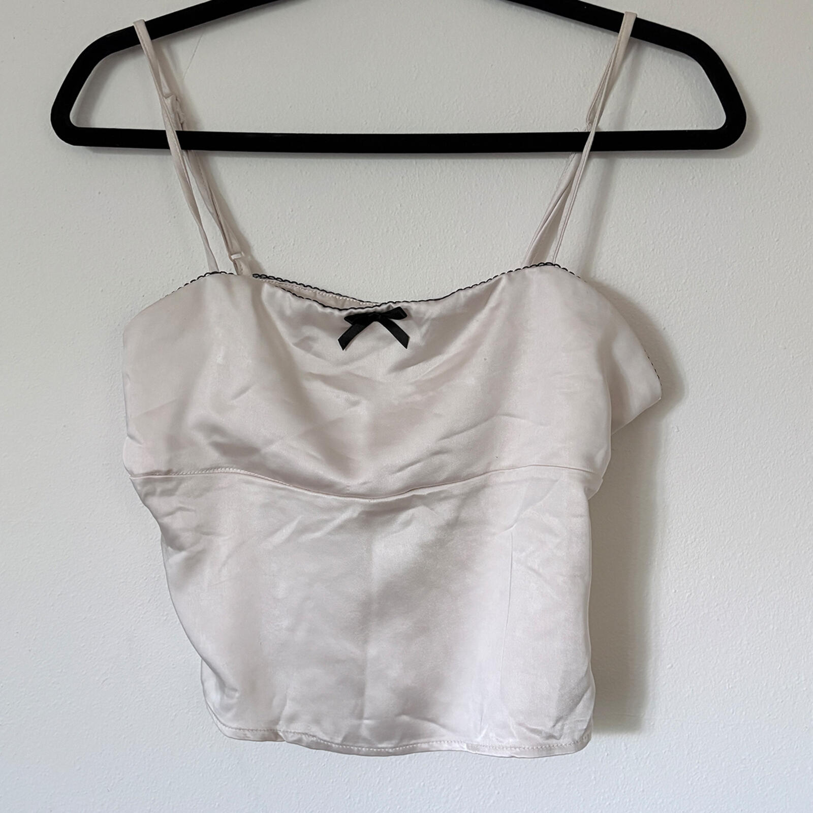 Elegant Cream Satin Camisole Top with Black Bow Accent