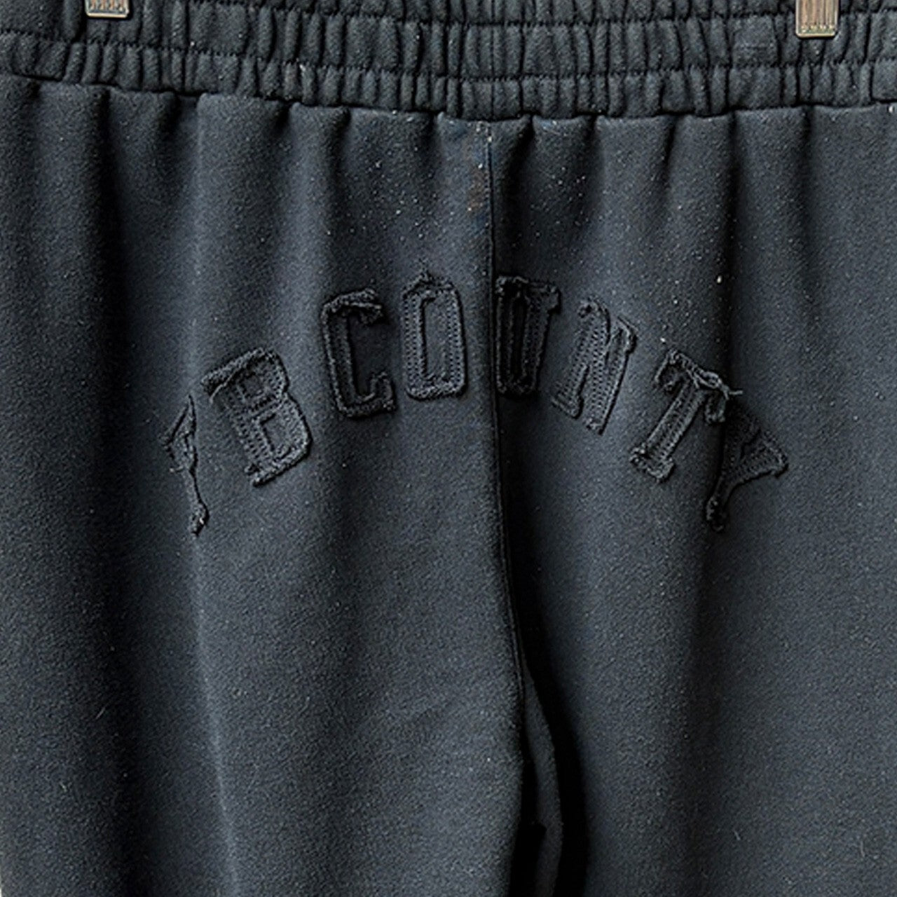 FB County Black Sweatpants Size L with Frayed Hem Detail